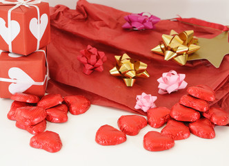 Red and white gift box with ribbons for love
