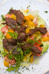 Grilled beef with vegetables on a plate