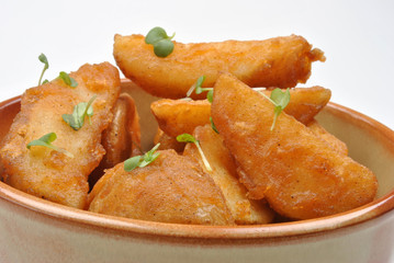 some fried potato wedges in a bowl