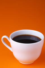 white coffee cup on color background