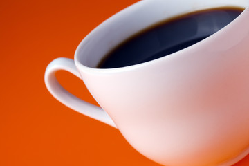 white coffee cup on color background