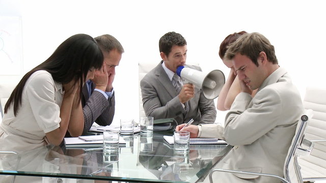 Businessman yelling through a megaphone