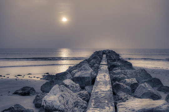 Stone pier at sunrise. © Anette Andersen