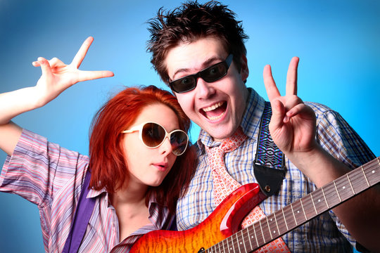 Fashion boy and girl with guitar whow OK