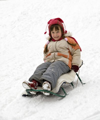Fototapeta na wymiar Girl sledding.