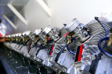 Engines from kart cars in row line for been inspected