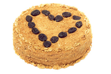 honey-walnut cake with prune stuffing isolated on white