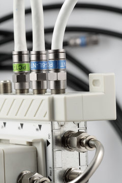 Close-up part of device and connectors to distribute TV signal