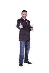 Businessman celebrating with a glass of drink