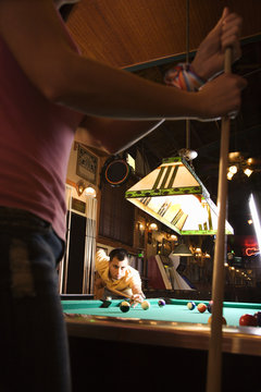 Young Man Playing Billiards