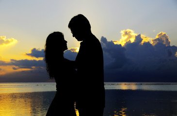 Couples figure with sunset background