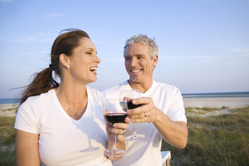 Couple Drinking Wine on Beach