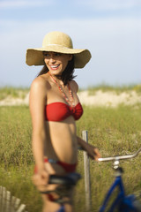 Woman with Bicycle at Beach