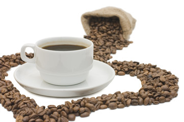 Cup from coffee on coffee grains isolated