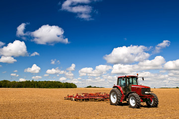 Tractor in plowed field