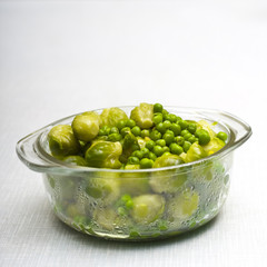 Bowl of freshly steamed peas and vegetables