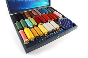 Colorful thread rolls in a box