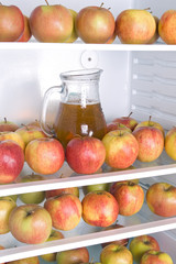 apples with jug in the refrigerator