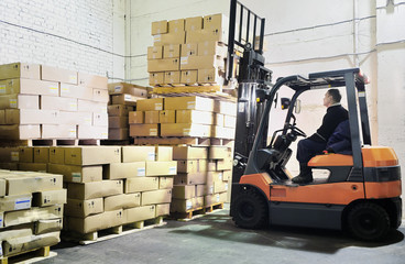 Forklift loader in warehouse