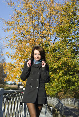 On the bridge in autumn park