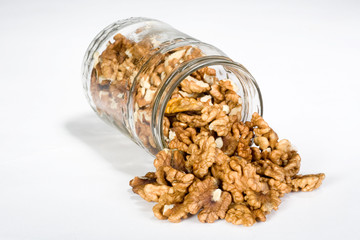 walnuts in Glass Jar isolated on the white background