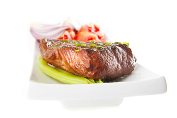 beef meat served on white