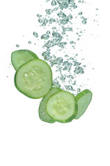 Segments of cucumbers in water