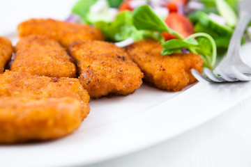 Chicken nuggets with salad