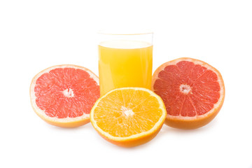 Glass of orange juice and sliced fruits