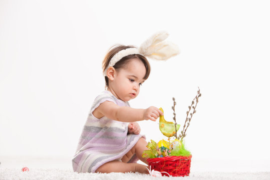 Baby playing with easter basket