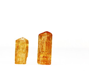 Two orange Imperial Topaz crystals, birthstone for November