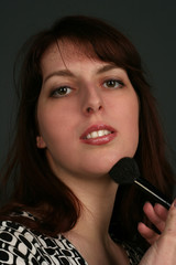 Obraz premium Young beautiful woman to do a make-up