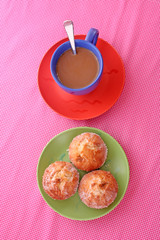 Three cupcakes and coffee on the table