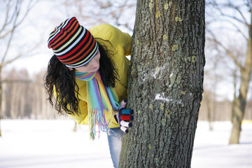 teen girl with snowball, surprised