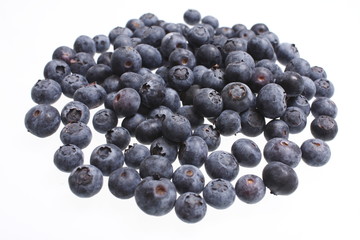 Pile of fresh blueberries isolated on white.