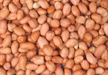raw peeled peanut close up or macro