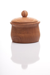 Closed wooden sugar-basin on isolated white background