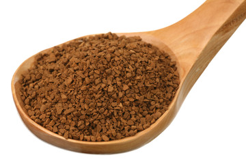 Instant coffee in a wooden spoon on a white background