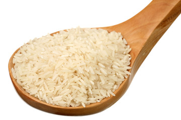 White rice in a wooden spoon. It is isolated.