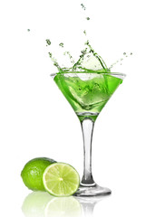 Fototapeta na wymiar Green alchohol cocktail with splash and green lime