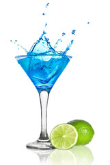 Blue curacao cocktail with splash and green lime