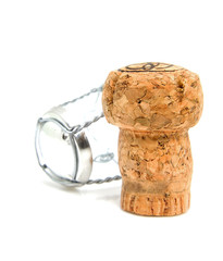 Champagne cork in closeup over white background