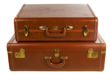 vintage leather suitcases, against white