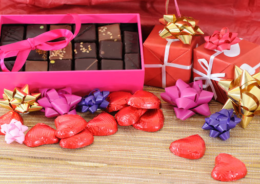 Red and white gift box with ribbons for love