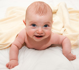 baby on white bed