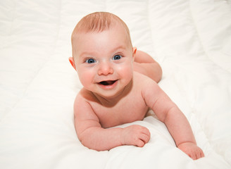 baby on white bed