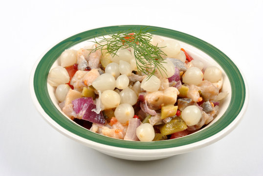 some fresh organic herring salad  in a bowl