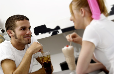 Couple sharing sodas