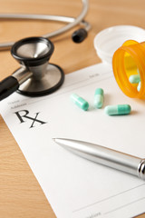 Prescription with Pills and stethoscope