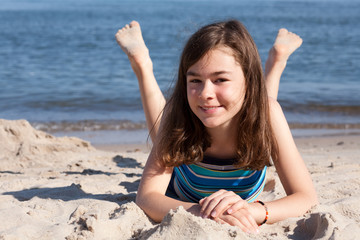 Girl lying on beach